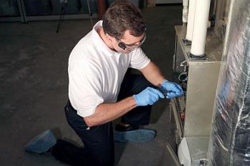 Mike is fixing a furnace unit 